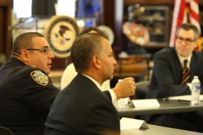 Captain Joseph M. Gulotta of the 73rd Precinct speaks at the roundtable. In foreground is James Brodick, director of the Brownsville Community Justice Center. In background is Thomas Abt, the chief of staff of the Department of Justice’s Office of Justice Programs.