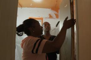 Red Hook staff visits community member to see the condition of their home