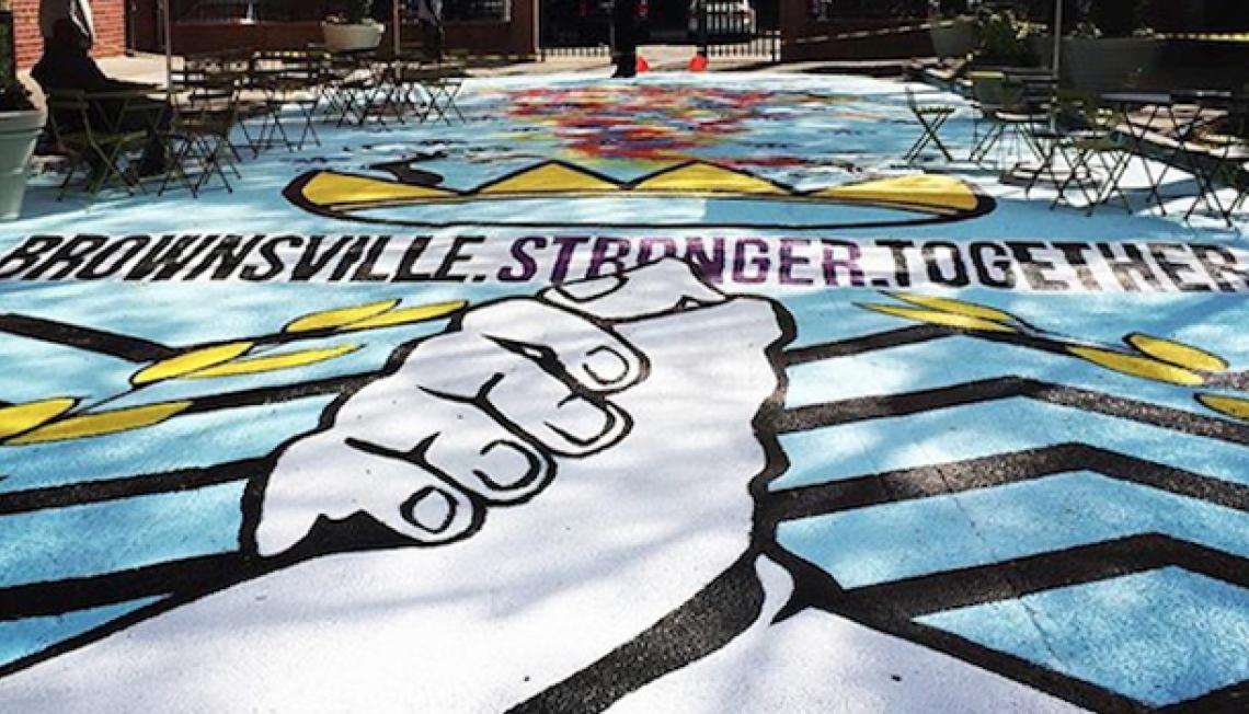 Brownsville Stronger Together mural; shows two hands clasped together