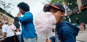 Kid eating cotton candy