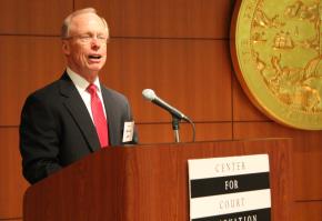 Judge Steven Jahr, administrative director of the courts in California, addresses the summit. The California Administrative Office of the Courts hosted the summit in its headquarters in San Francisco.