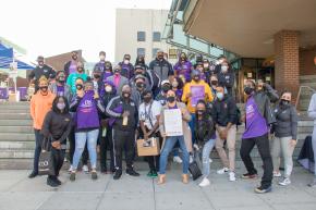 Large group photo of RISE team wearing purple shirts from the New York Crisis Management System
