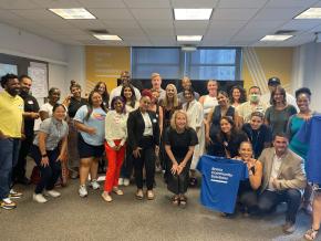 Center staff pose for a group photo at a harm reduction summit in our headquarter office.