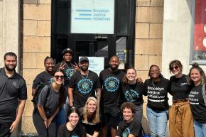Brooklyn Justice Initiatives staff group photo in front of their Brooklyn office